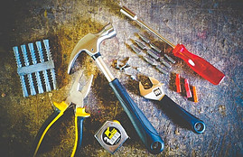 assorted tools lying on table