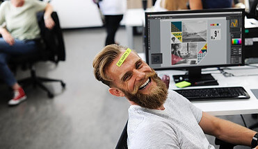 senior-over-50-at-desk-job-smiling