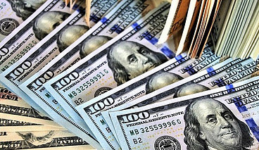 stack of hundred dollar bills